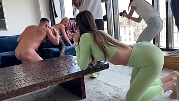 Teen girl gives blowjob backstage while filming orgy scene